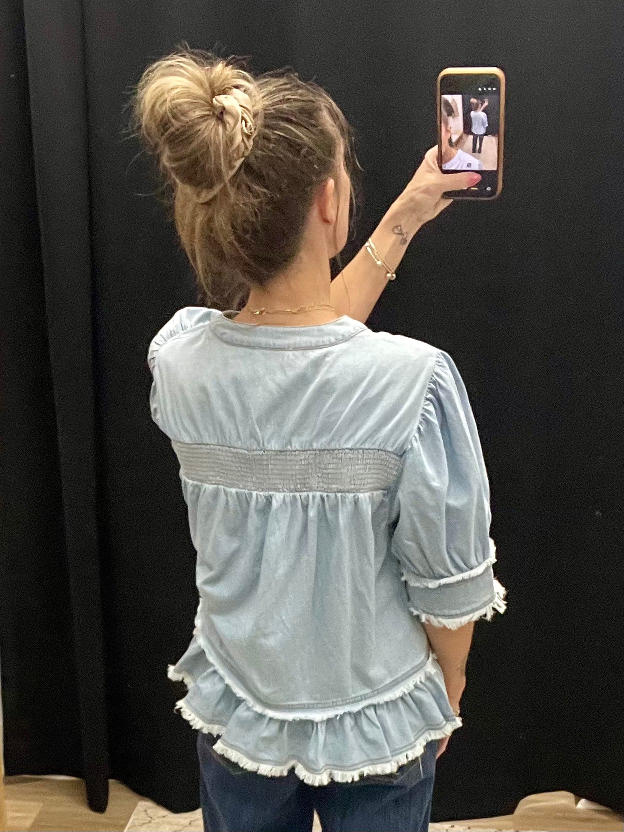 THE DOLLY LT DENIM SMOCK DETAIL RUFFLE HEM TOP