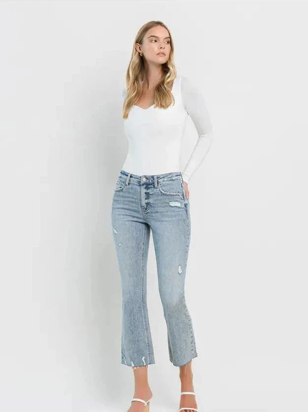 THE CALI DISTRESSED KICK FLARE CROP DENIM