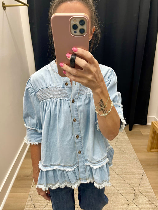 THE DOLLY LT DENIM SMOCK DETAIL RUFFLE HEM TOP