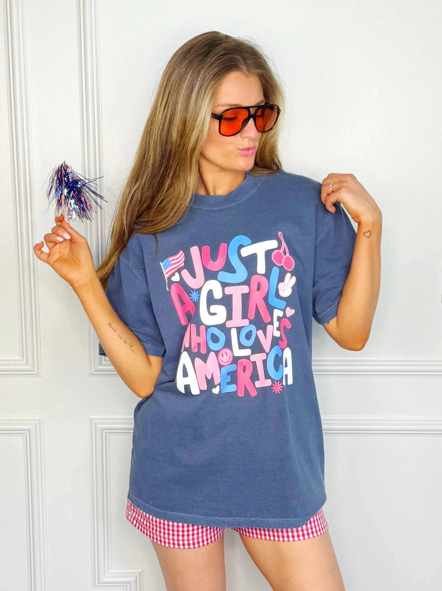 THE JUST A GIRL GRAPHIC TEES