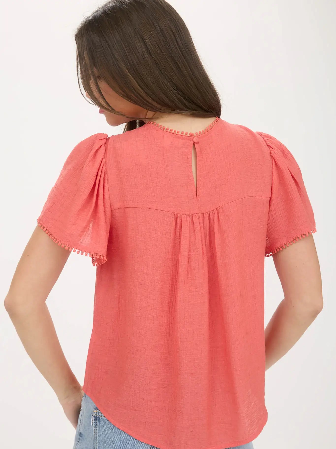 THE MARYBETH LACE YOKE POMPON BLOUSE - coral