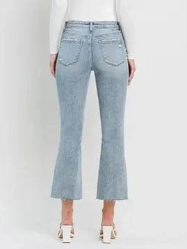 THE CALI DISTRESSED KICK FLARE CROP DENIM